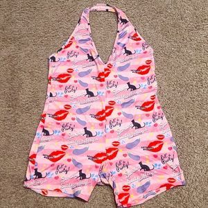 Size xl onesie with buttflap. Buttflap snaps in place can be unbuttoned easily.